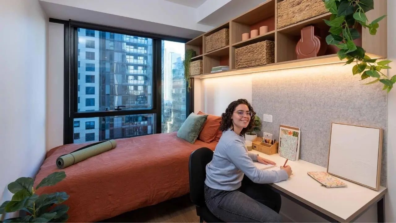 Bed desk and shelves with view bedroom study area at UniLodge Melbourne Central in Melbourne Student Accommodation