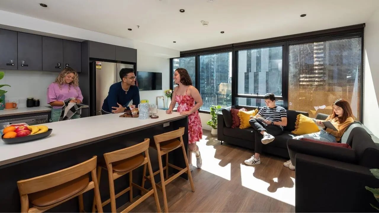 Kitchen bar area with students living room living room at UniLodge Melbourne Central in Melbourne Student Accommodation