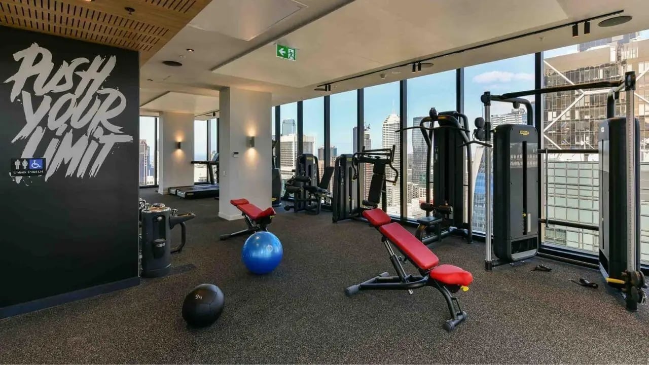 Gym equipment and city view Image Type gym at UniLodge Melbourne Central in Melbourne Student Accommodation