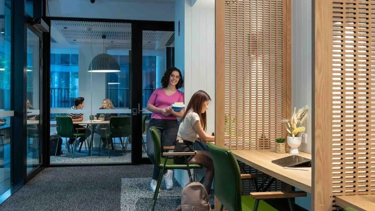 Students studying at shared desks study area at UniLodge Melbourne Central in Melbourne Student Accommodation