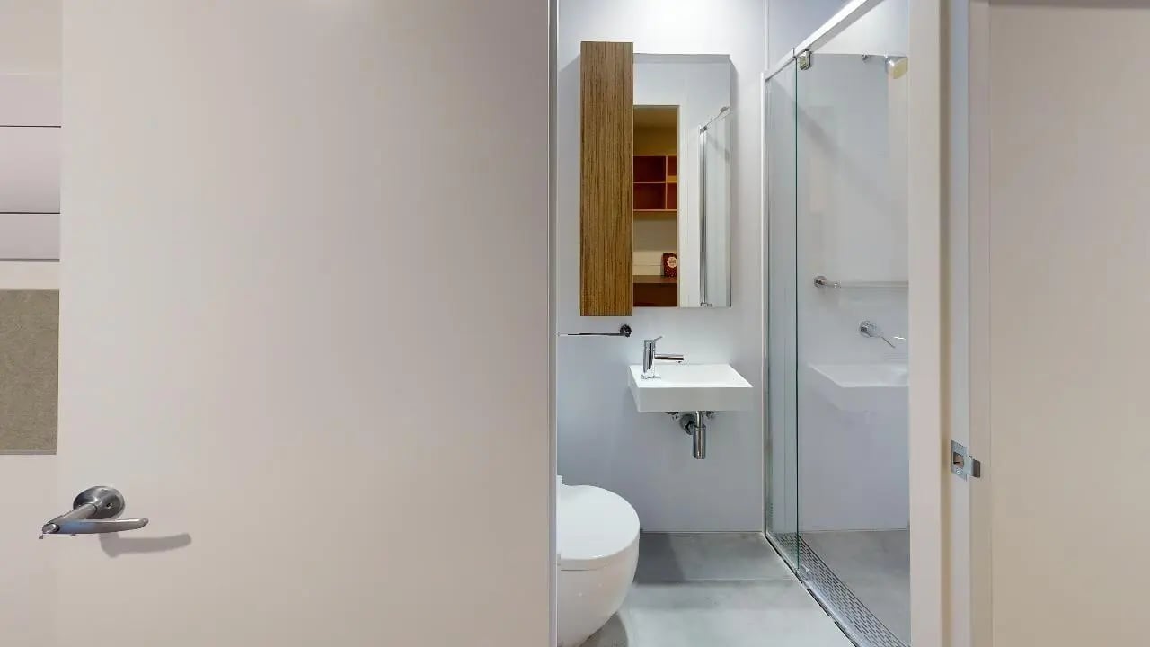 Toilet sink shower with glass door bathroom at Unilodge Melbourne City in Melbourne Student Accommodation
