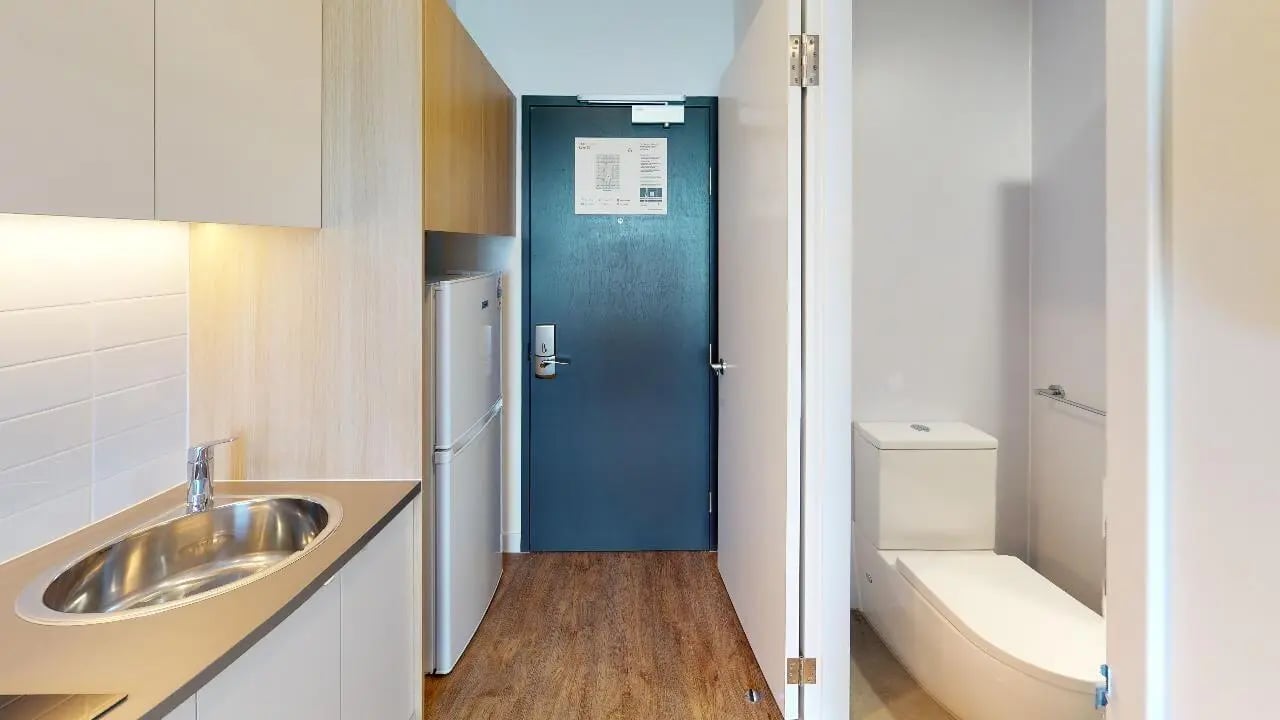 Kitchen counter sink refrigerator and bathroom toilet bathroom at Unilodge Melbourne City in Melbourne Student Accommodation