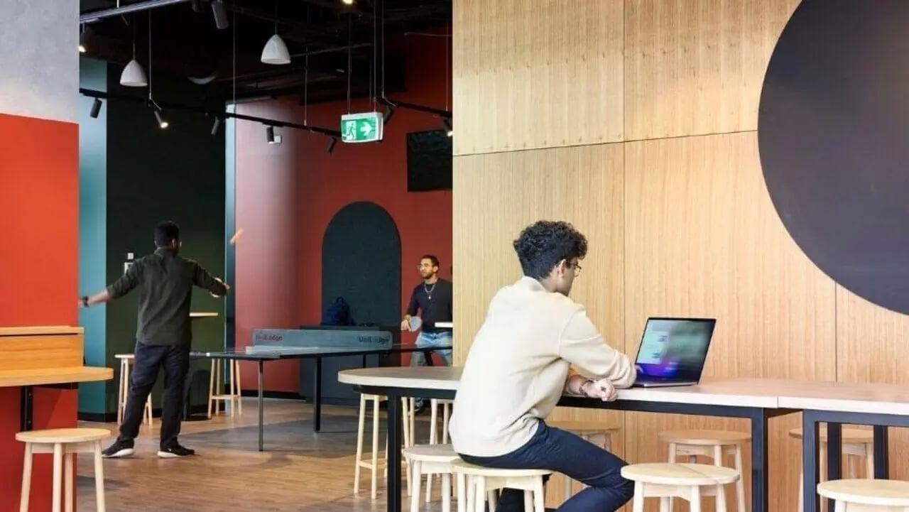 Students play ping pong and use laptop study area at Unilodge Melbourne City in Melbourne Student Accommodation