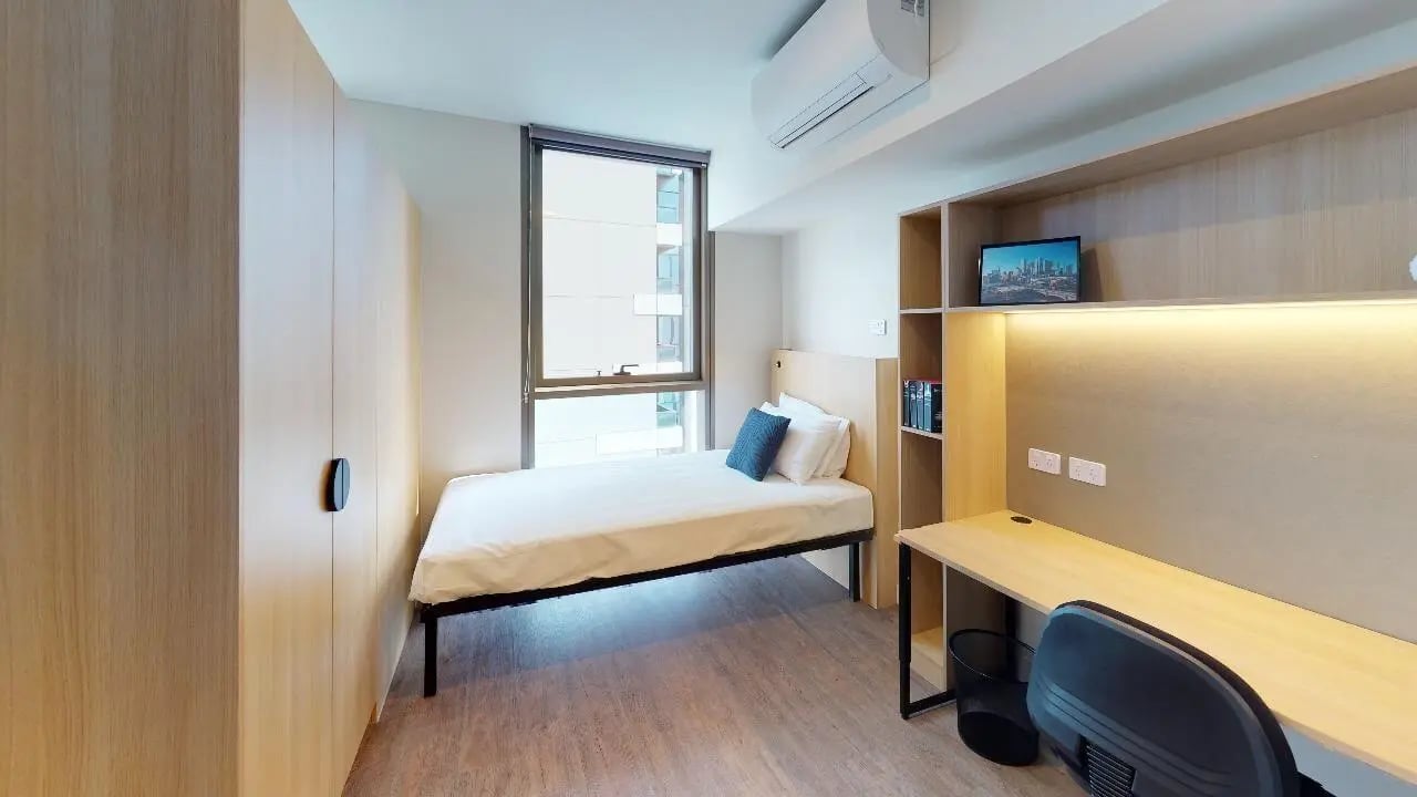 Bed desk wardrobe and shelves bedroom at Unilodge Melbourne City in Melbourne Student Accommodation