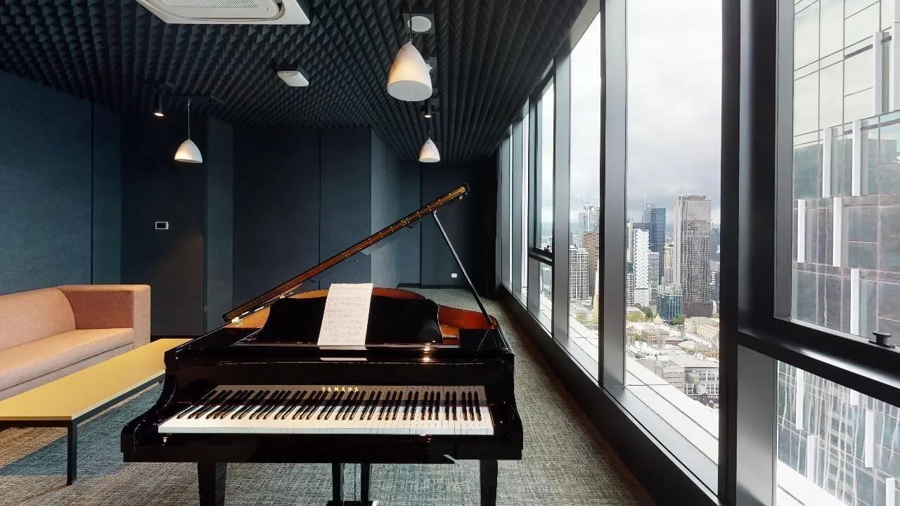 Grand piano and sofa in music room at Unilodge Melbourne City in Melbourne Student Accommodation