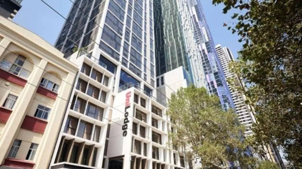 Modern Uni Lodge building with city skyline exterior at Unilodge Melbourne City in Melbourne Student Accommodation