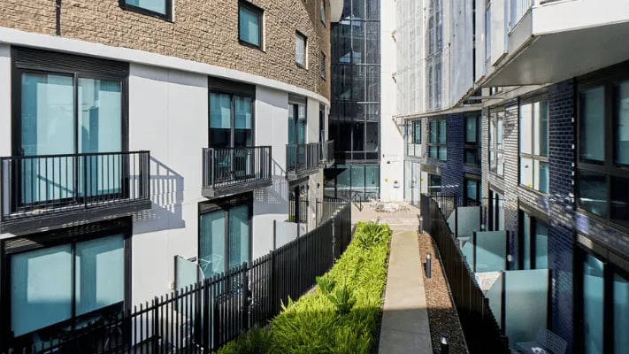 Courtyard with balconies and modern buildings exterior at UniLodge Park Avenue in Melbourne Student Accommodation