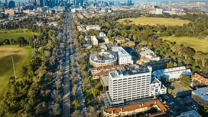 Apartment buildings line tree-lined street exterior at UniLodge Park Avenue in Melbourne Student Accommodation