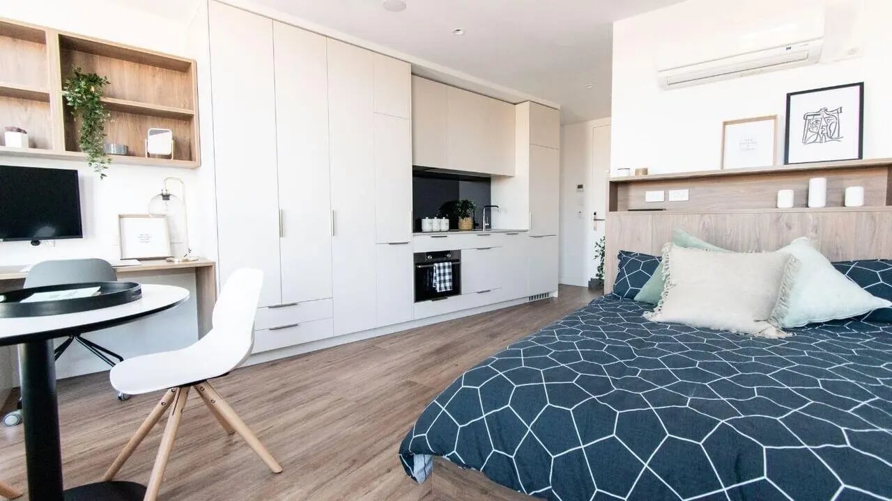 Bed study desk kitchen wardrobes Studio apartment at UniLodge Park Avenue in Melbourne Student Accommodation