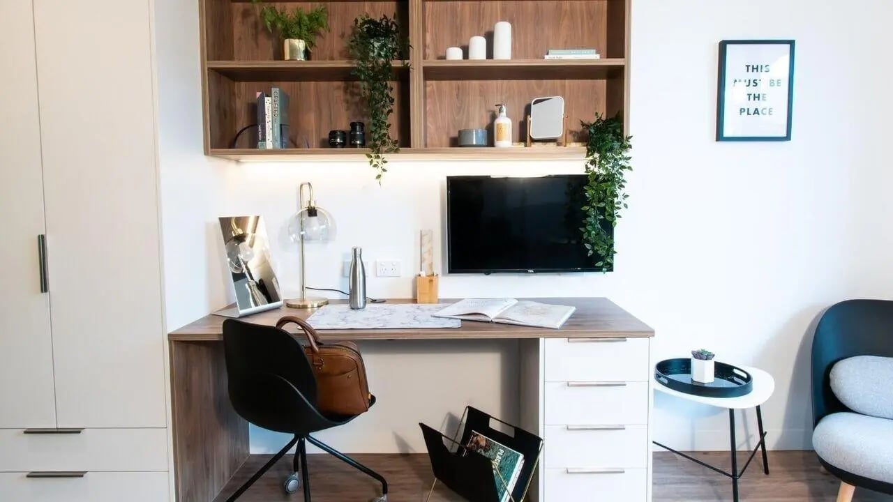Desk chair shelves television framed art study area at UniLodge Park Avenue in Melbourne Student Accommodation