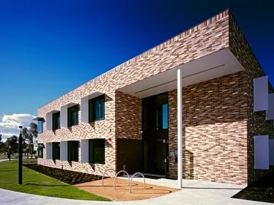 Modern brick student housing exterior with bike rack exterior at La Trobe University - McFarlane's Hill Residences in Wodonga Student Accommodation