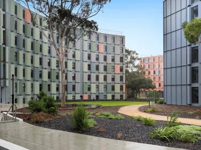 Modern student housing buildings with curved facades exterior at La Trobe University - North and South Apartments in Melbourne Student Accommodation