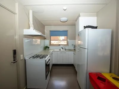White stove refrigerator sink cabinets kitchen at La Trobe University - Villas in Melbourne Student Accommodation