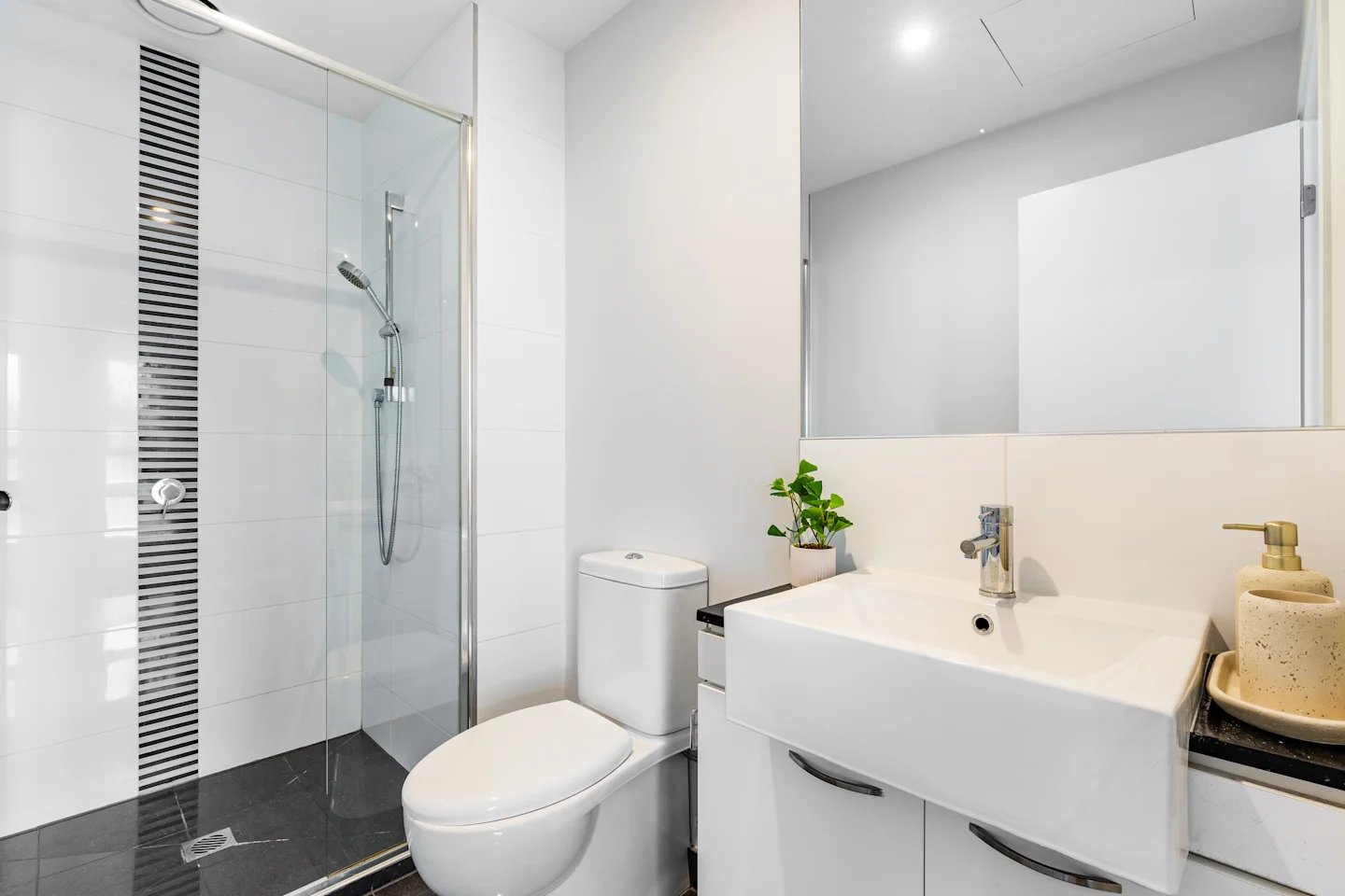 Toilet sink and shower stall bathroom at UKO Royal Park in Melbourne Student Accommodation