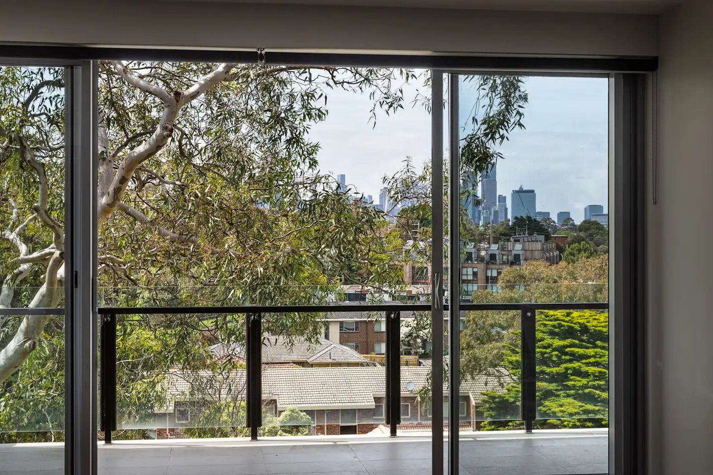 Balcony with city view and trees balcony view at UKO Royal Park in Melbourne Student Accommodation