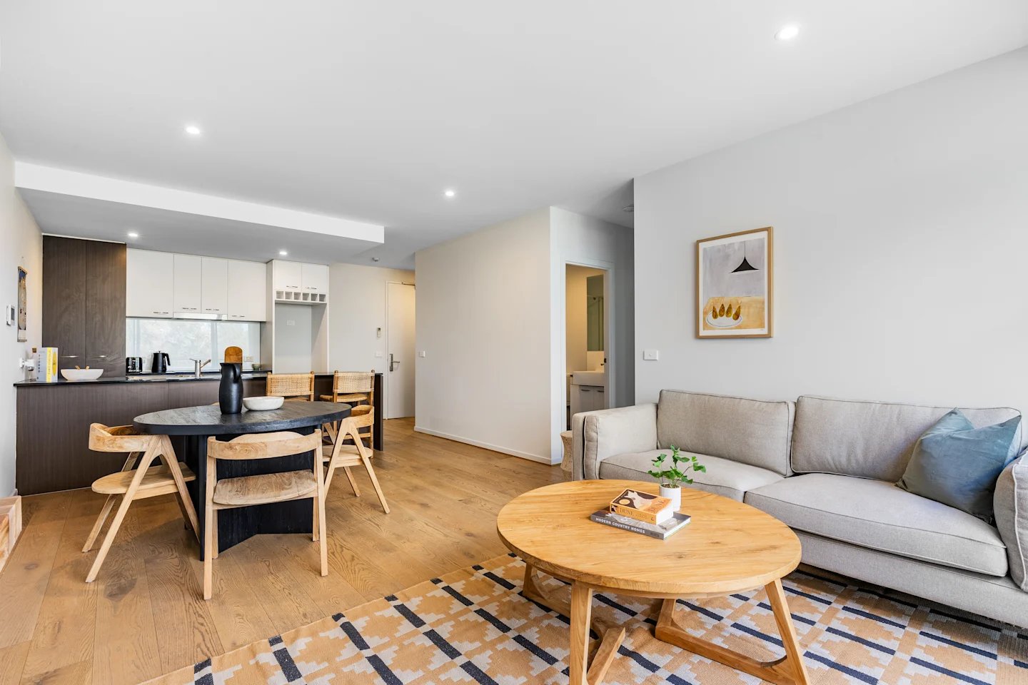 Dining area with kitchen and living room at UKO Royal Park in Melbourne Student Accommodation