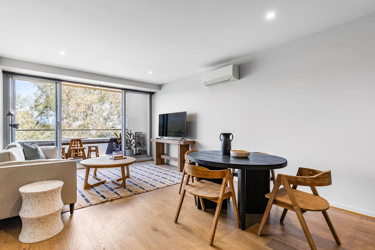 Sofa coffee table dining set television living room at UKO Royal Park in Melbourne Student Accommodation