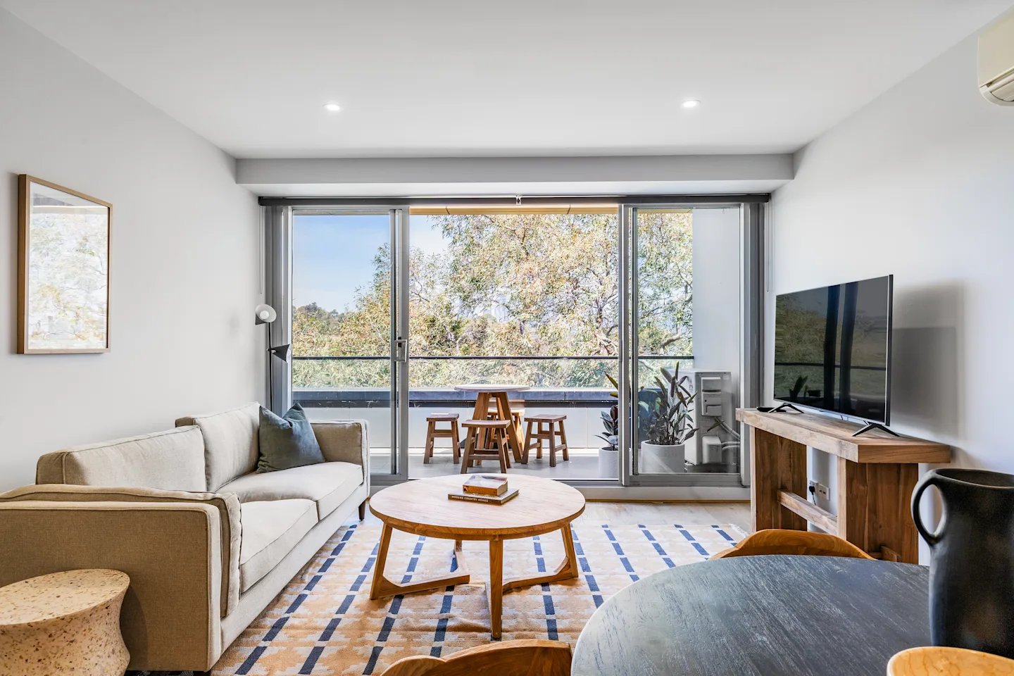 Sofa coffee table TV balcony furniture living room at UKO Royal Park in Melbourne Student Accommodation