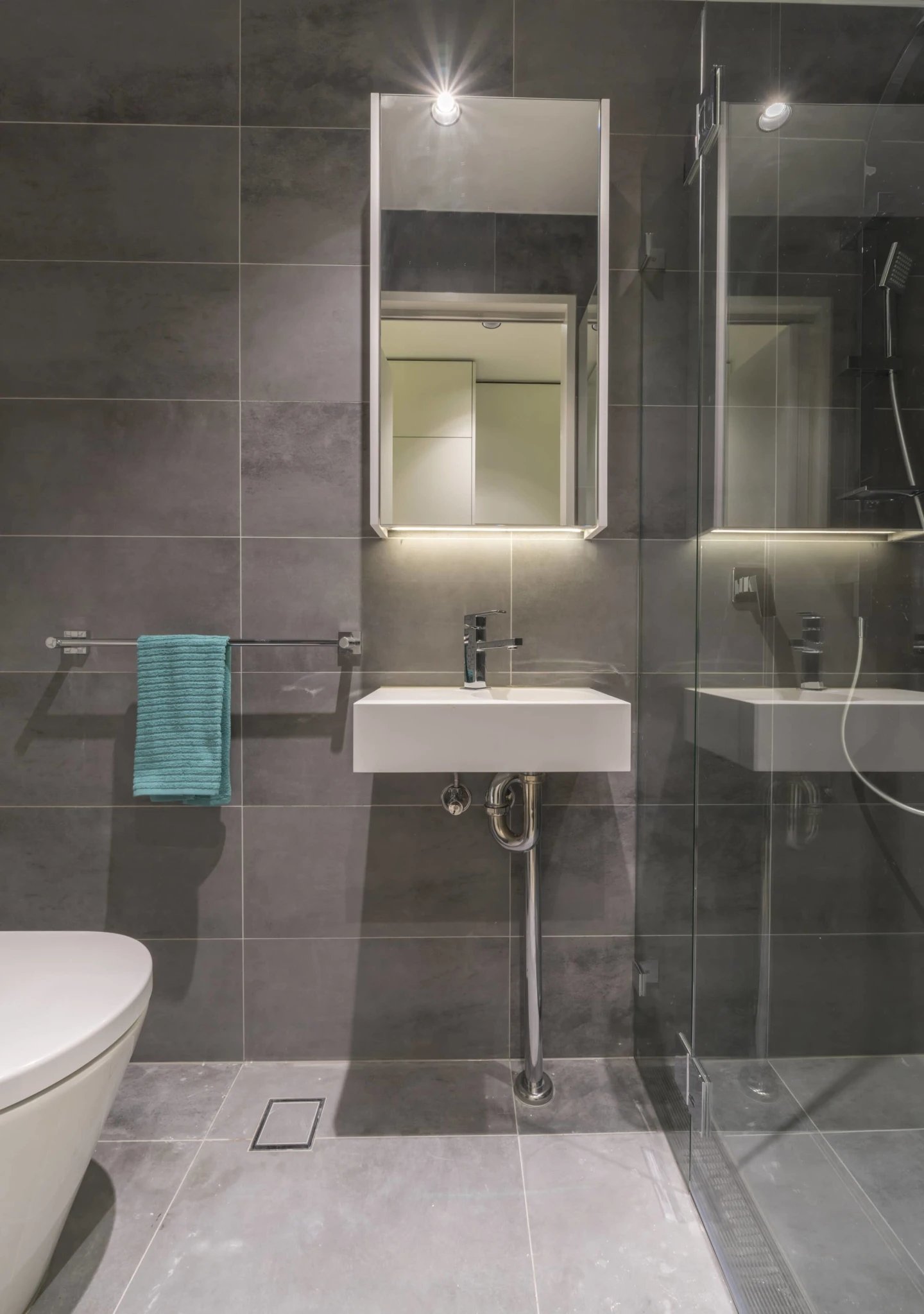 Modern bathroom with white sink and shower. Bathroom at UKO Surry Hills in Sydney Student Accommodation