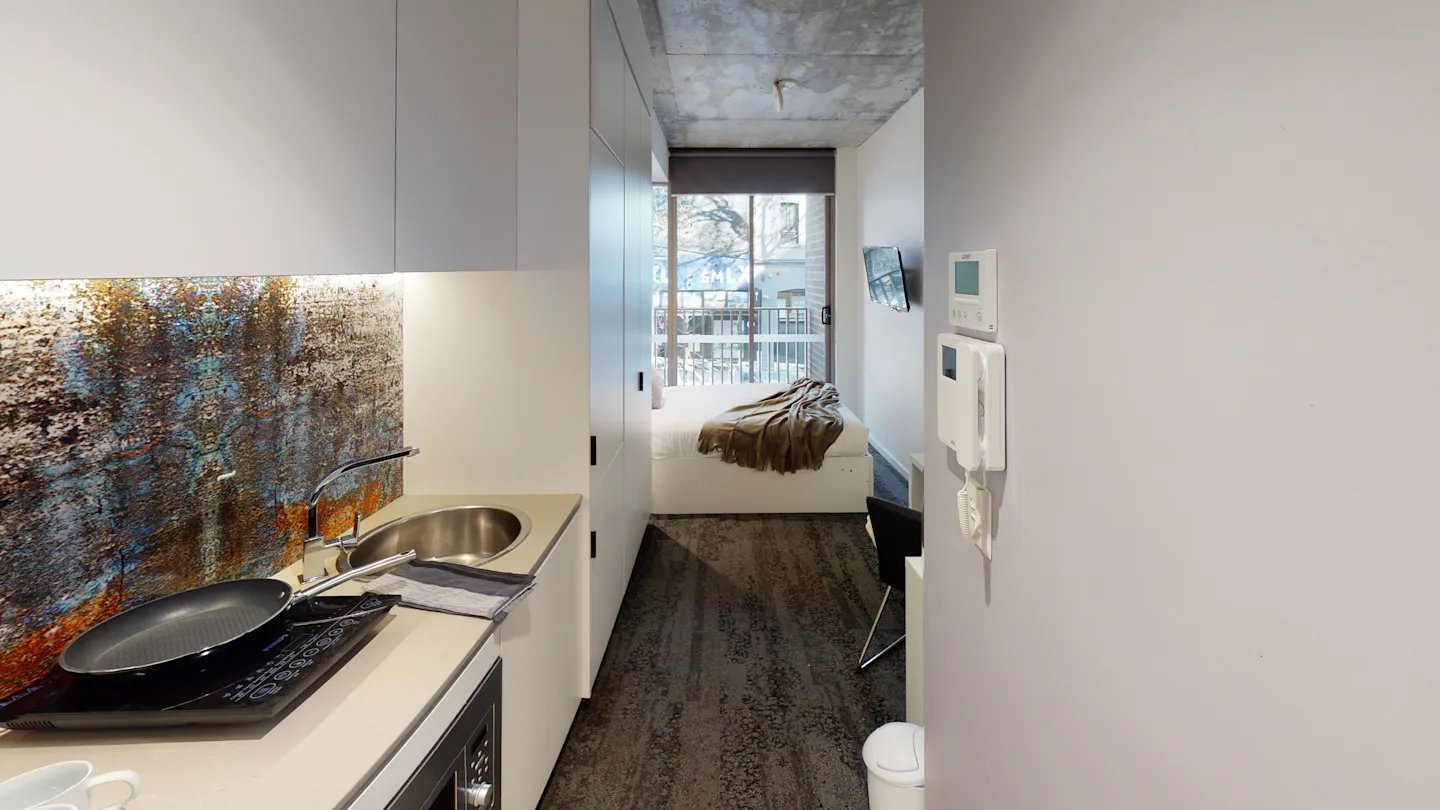 Kitchen with sink and bed area living room at UKO Surry Hills in Sydney Student Accommodation