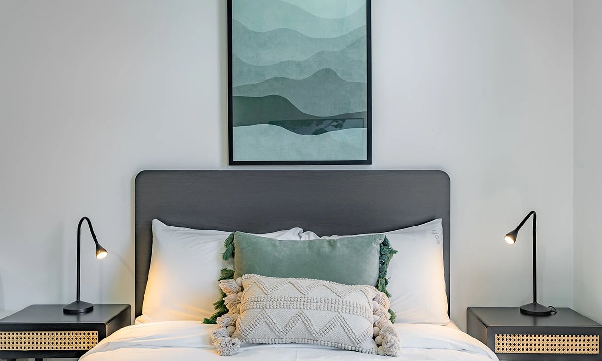 Bed pillows lamps artwork Bedroom at UKO Sutherland in Sydney Student Accommodation