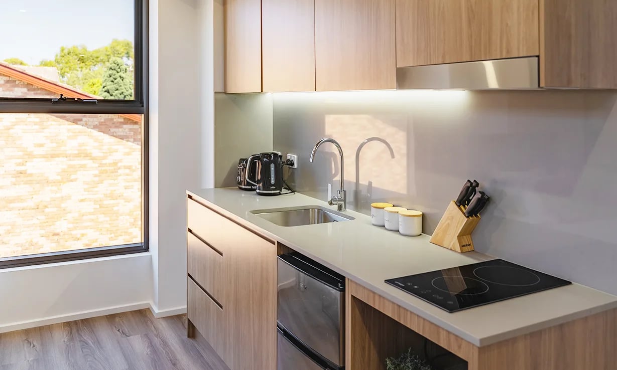Countertop sink kettle induction hob kitchen at UKO Sutherland in Sydney Student Accommodation