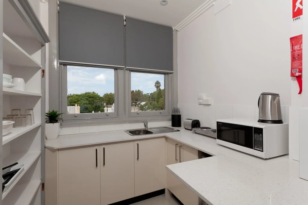 Kitchen counter with microwave kettle toaster kitchen at ume Darlinghurst in Sydney Student Accommodation