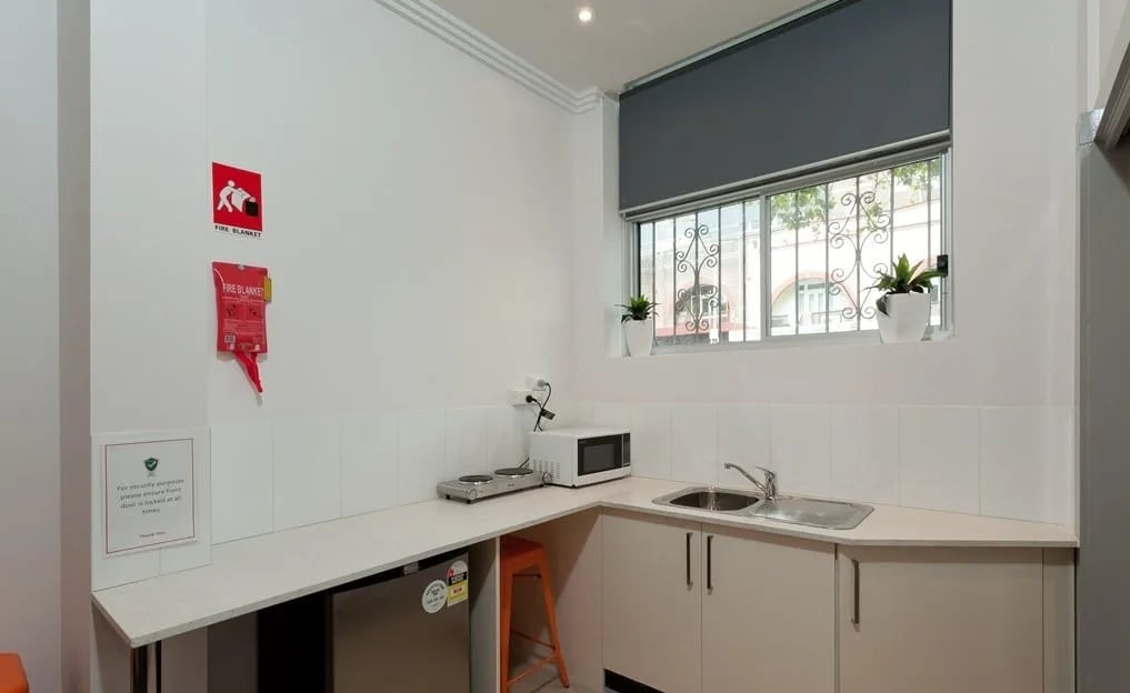 Kitchenette with microwave mini fridge and sink kitchen at ume Darlinghurst in Sydney Student Accommodation
