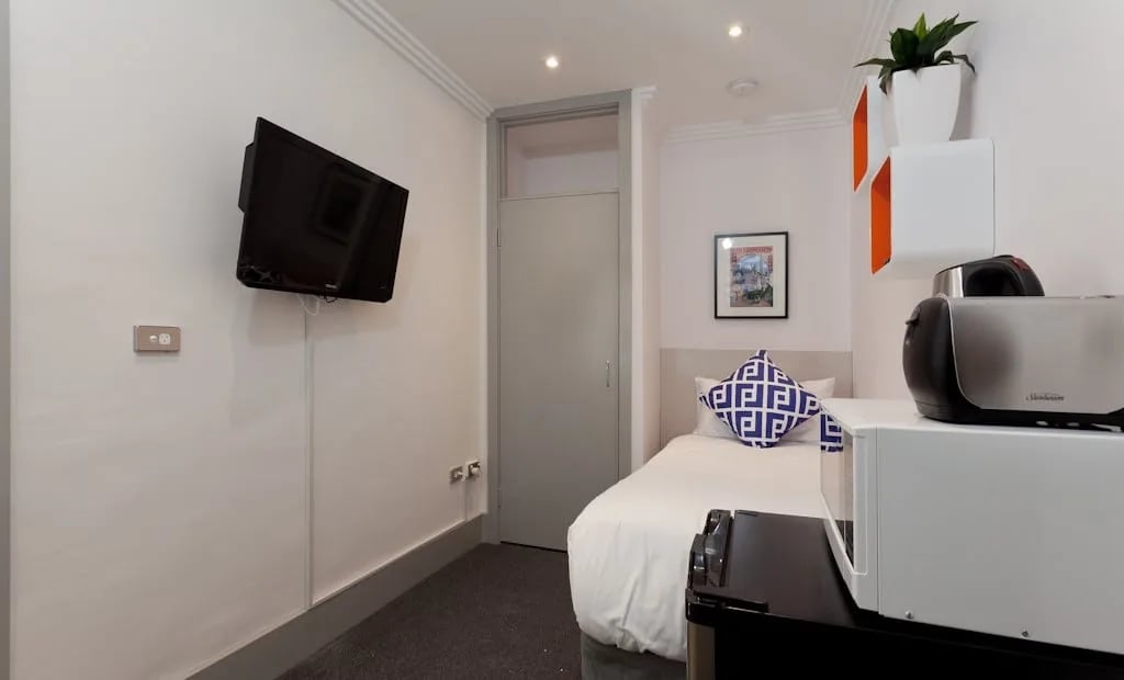 Wall mounted TV microwave toaster bed bedroom at ume Darlinghurst in Sydney Student Accommodation