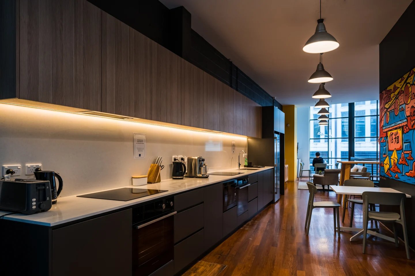 Modern student accommodation kitchen with counter and seating kitchen at ume Haymarket in Sydney Student Accommodation