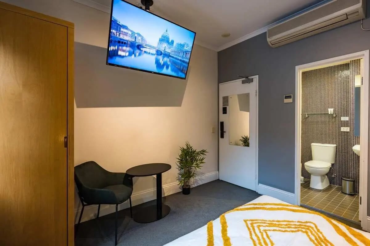 Wardrobe chair TV bathroom and toilet bedroom at ume Haymarket in Sydney Student Accommodation