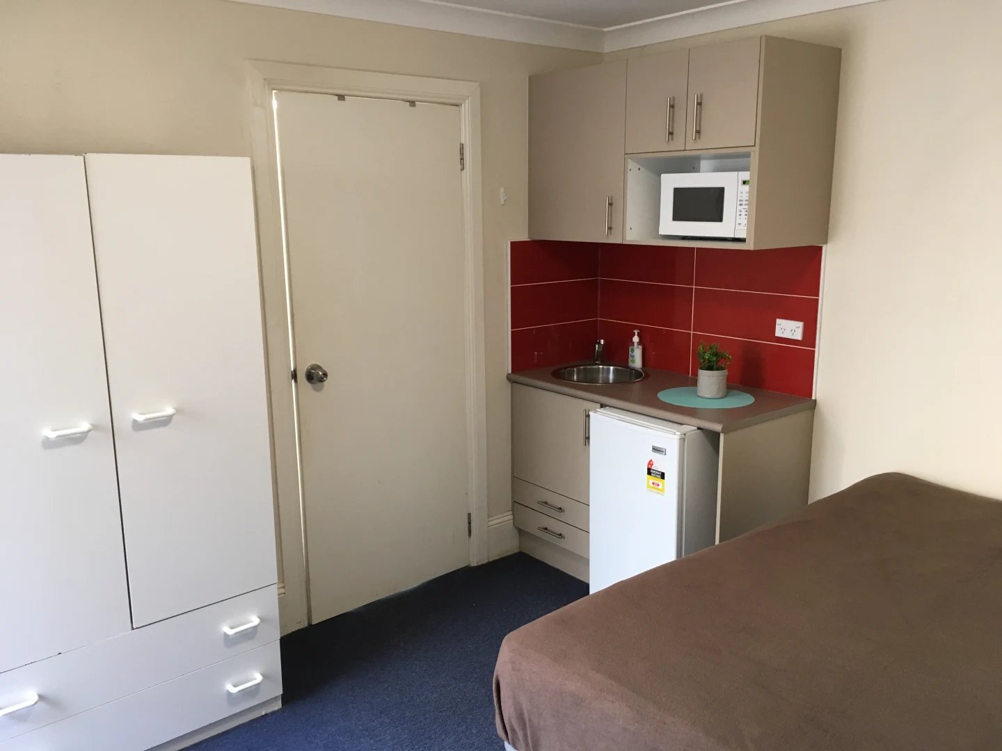 Wardrobe sink microwave fridge studio kitchen at ume Redfern in Sydney Student Accommodation