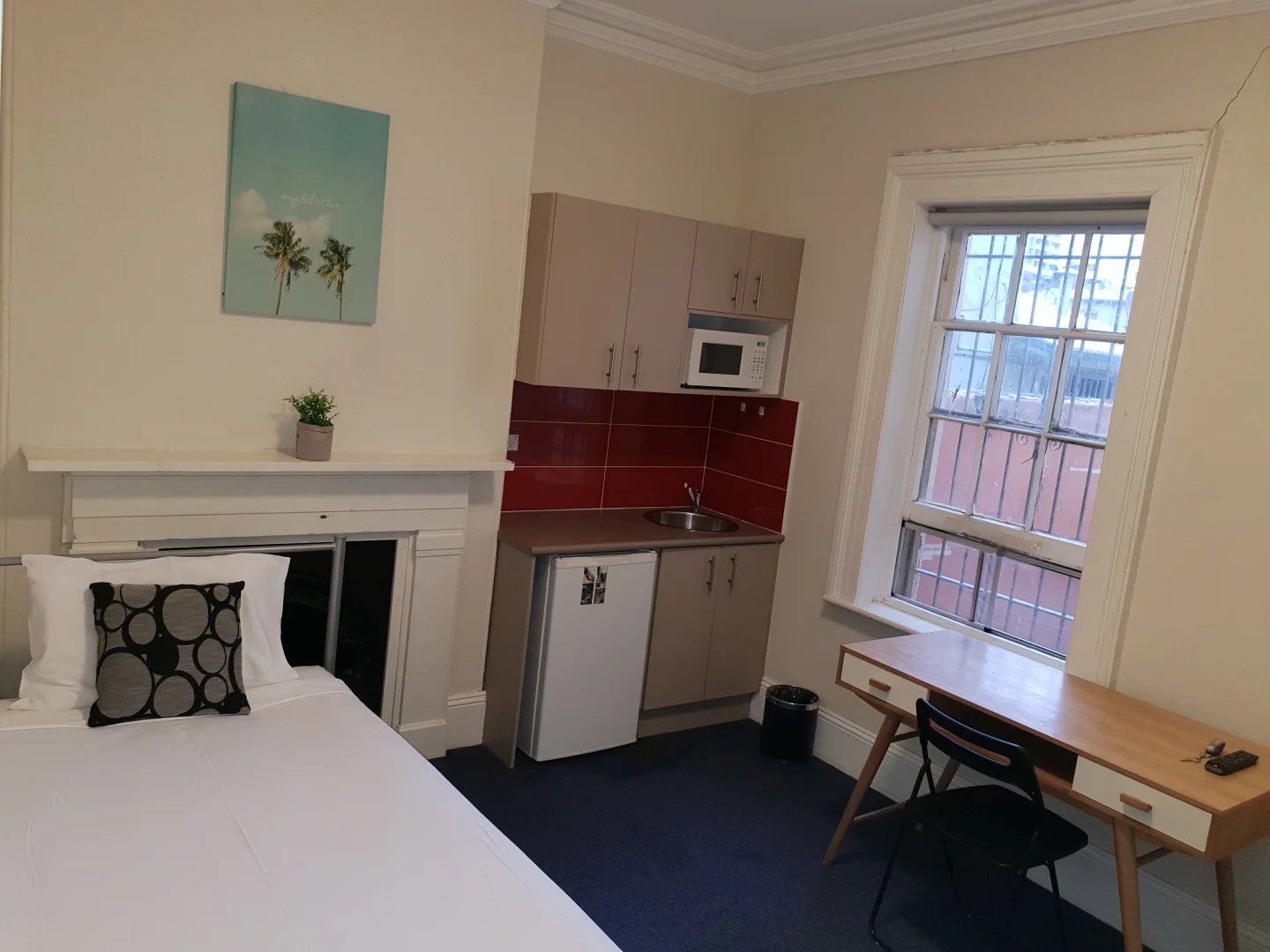 Bed kitchenette desk chair window study area at ume Redfern in Sydney Student Accommodation