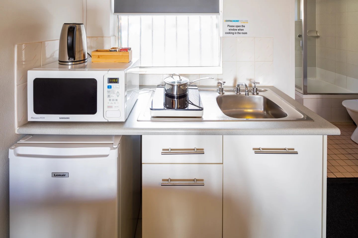 Microwave kettle pot sink and fridge kitchen at ume Redfern Village in Sydney Student Accommodation
