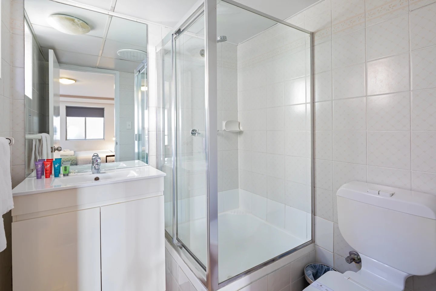 White vanity glass shower and toilet bathroom at ume Redfern Village in Sydney Student Accommodation