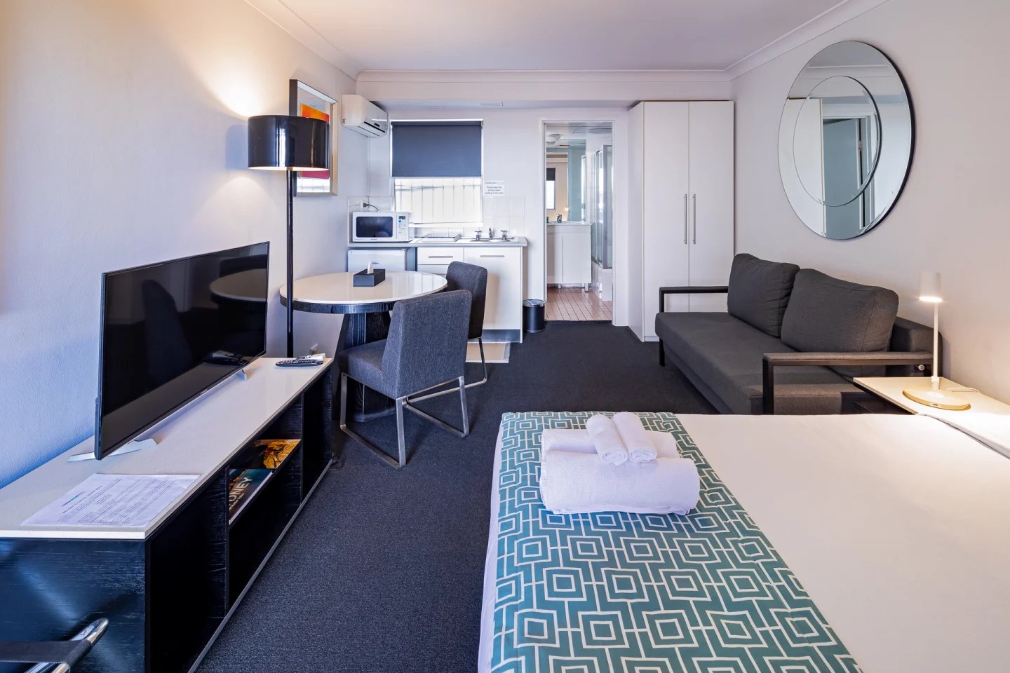 Bed kitchen sofa living room exterior at ume Redfern Village in Sydney Student Accommodation