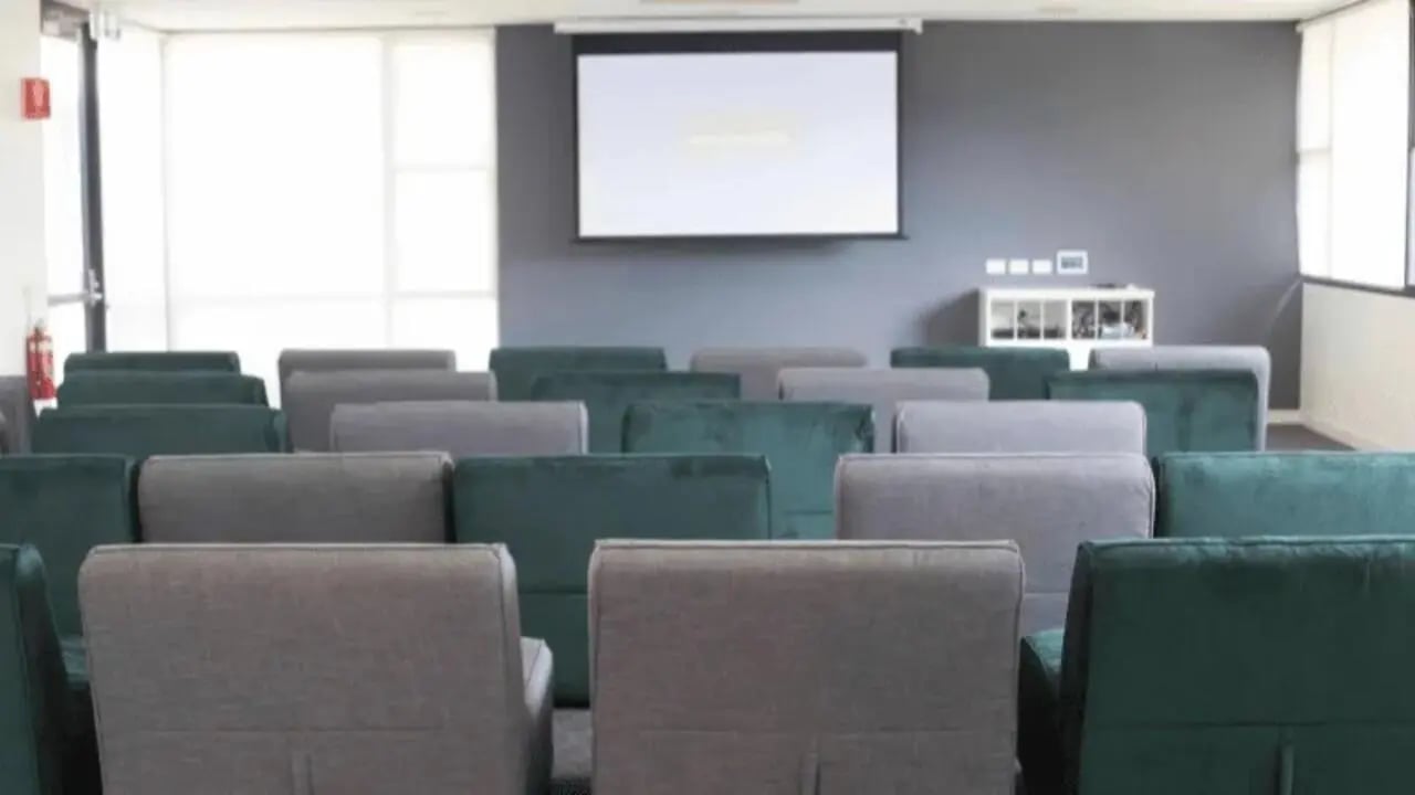 Seating arrangement with projection screen entertainment area at Western Sydney University Campbelltown Village in Sydney Student Accommodation