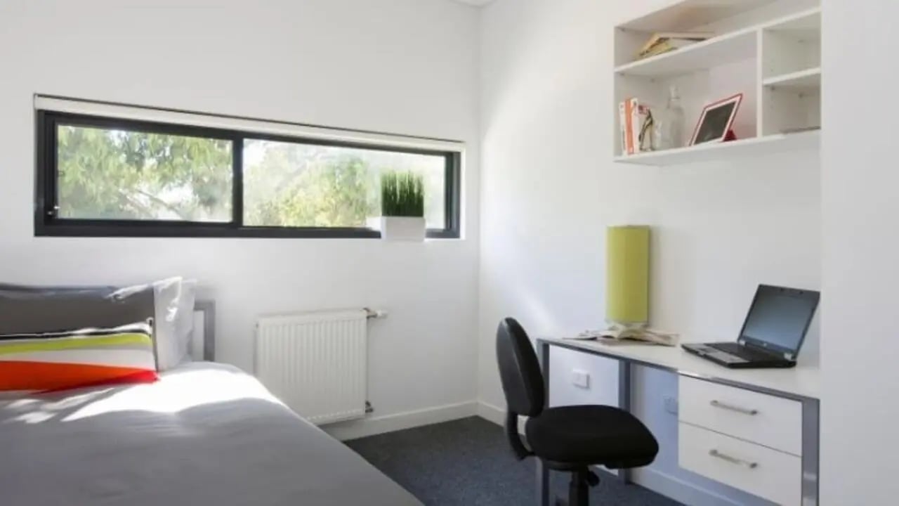 Bed desk and shelves in student room at Western Sydney University Campbelltown Village in Sydney Student Accommodation