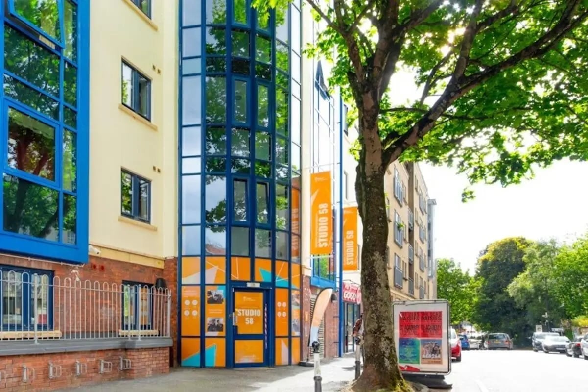 Modern building entrance with blue windows exterior at Studio 58 in Bristol Student Accommodation