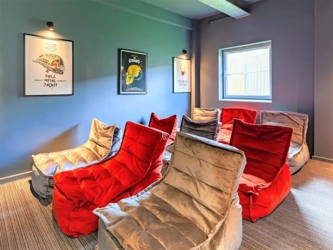 Beanbag chairs in a room with movie posters Movie room at Filbert Village in Leicester Student Accommodation