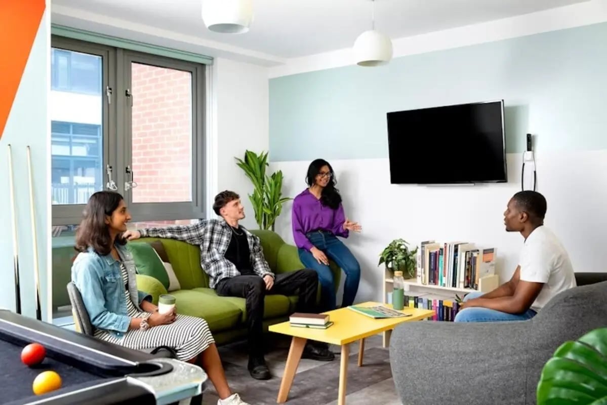 Sofa pool table TV and four people communal living room at Newarke Point in Leicester Student Accommodation