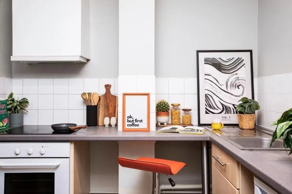Stove cutting boards picture cactus jars kitchen at Newarke Point in Leicester Student Accommodation