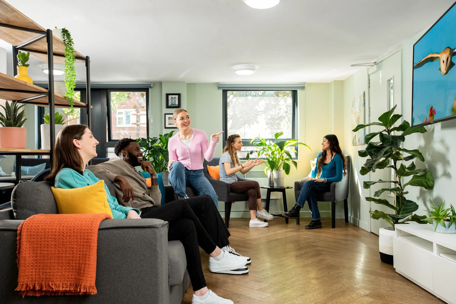Students relaxing in common area living room at Rahere Court in London Student Accommodation