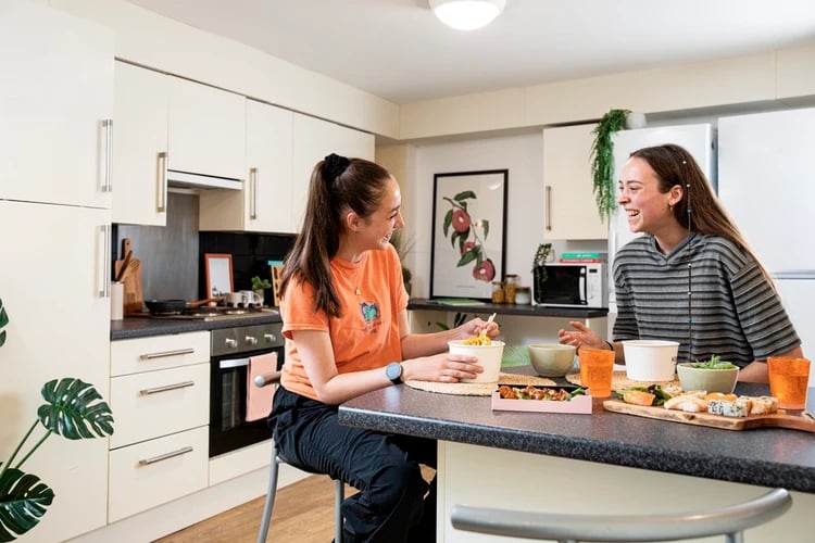 Students eating sushi and noodles kitchen at Wellington Lodge in London Student Accommodation