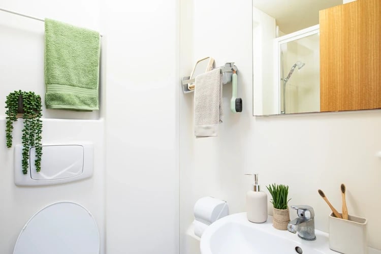 Sink toilet towels soap toothbrush holder bathroom at Piccadilly Court in London Student Accommodation