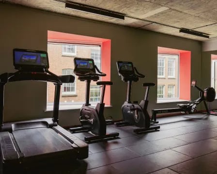 Treadmill stationary bikes rowing machine gym area at Scape Shoreditch in London Student Accommodation