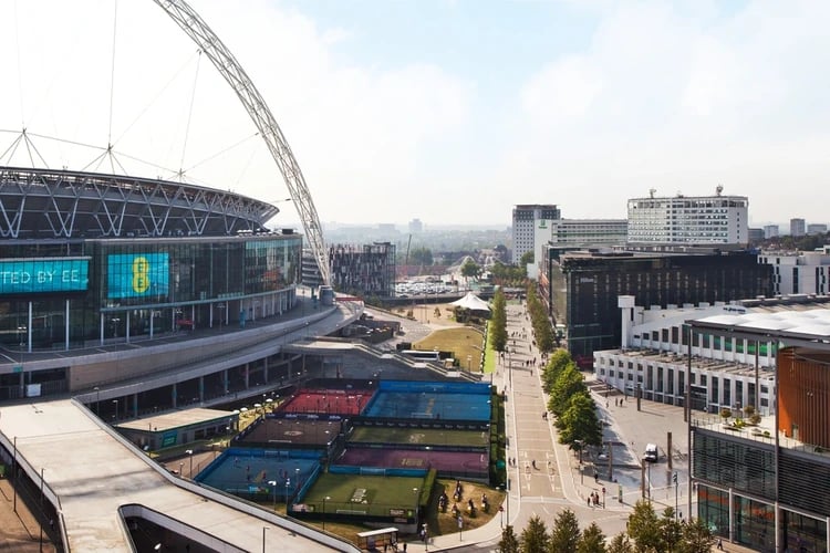 Colorful sports courts beside stadium buildings exterior at Olympic Way in London Student Accommodation