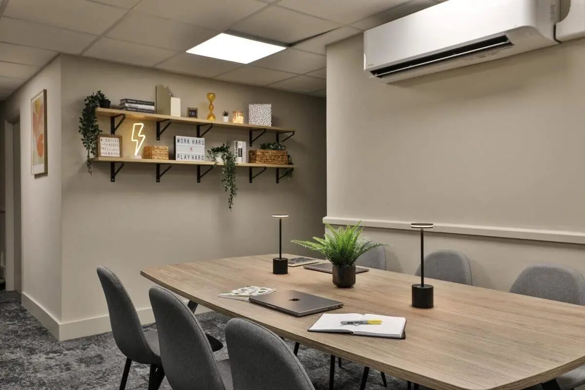 Table with chairs study area with shelves at Francis Gardner in London Student Accommodation