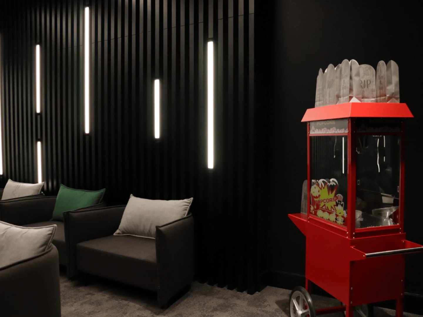 Modern lounge with chairs and popcorn machine lounge area at Spring Mews in London Student Accommodation