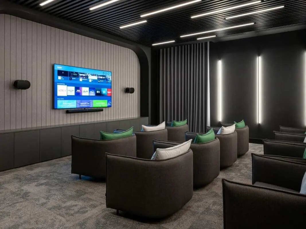 Ample seating in front of a large TV screen entertainment area at Spring Mews in London Student Accommodation